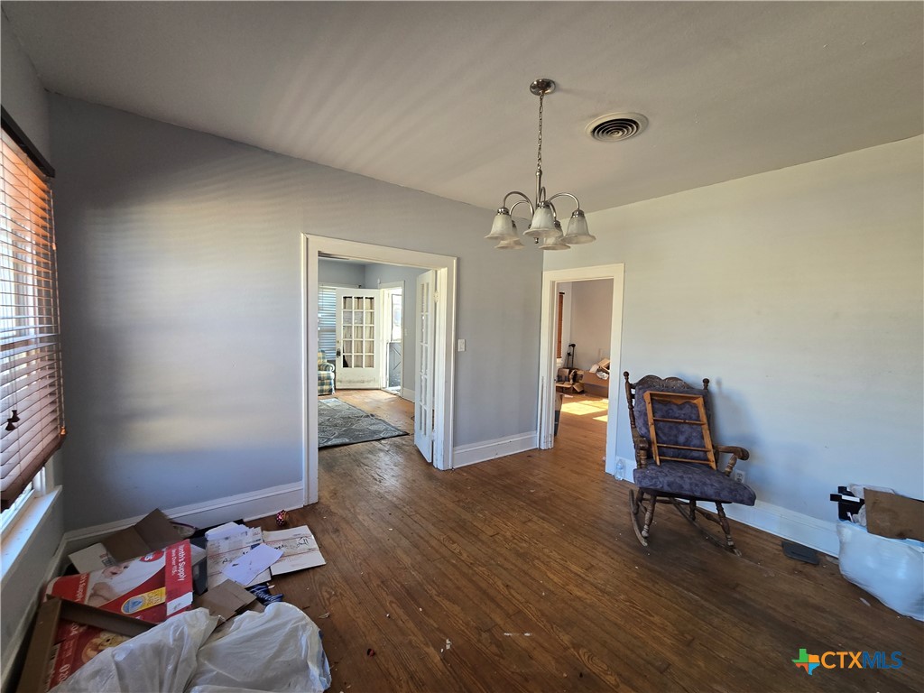 404 Fennimore Street Gatesville, TX 76528 - Photo 8 of 19 a room with furniture and wooden floor