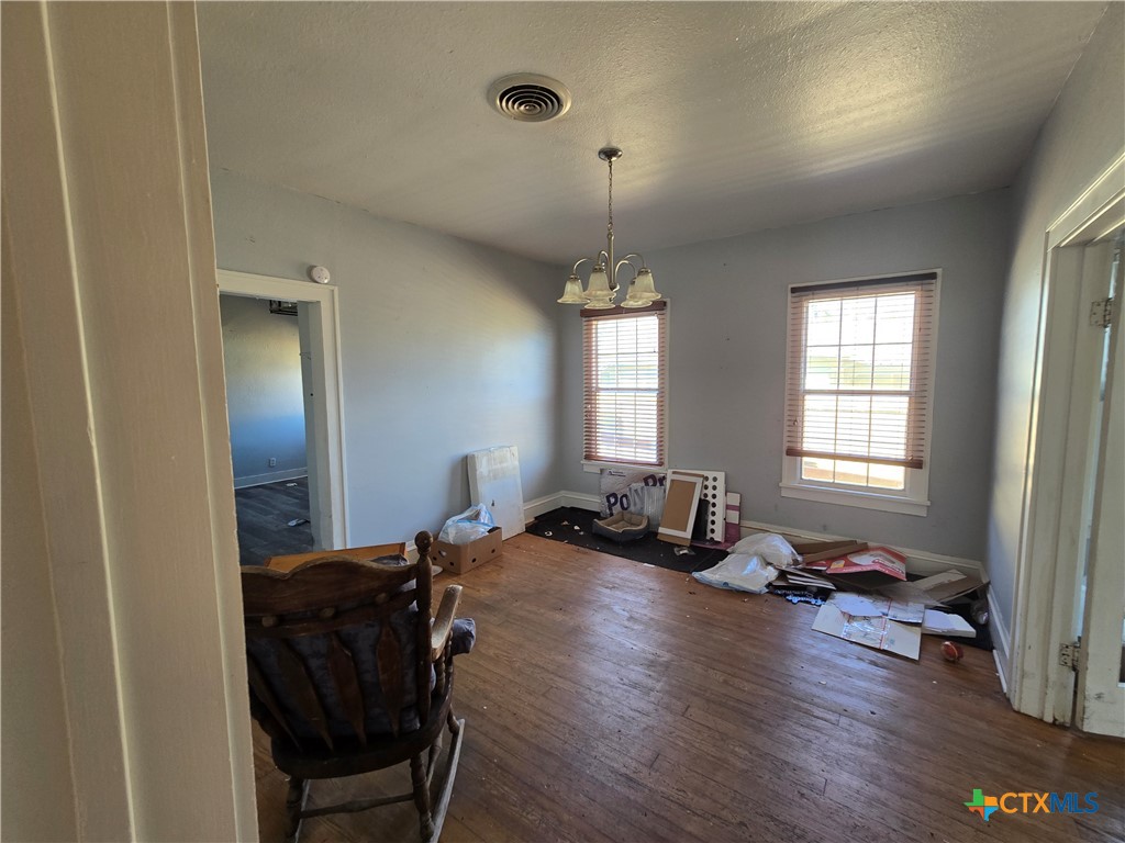 404 Fennimore Street Gatesville, TX 76528 - Photo 9 of 19 a living room with furniture and a wooden floor