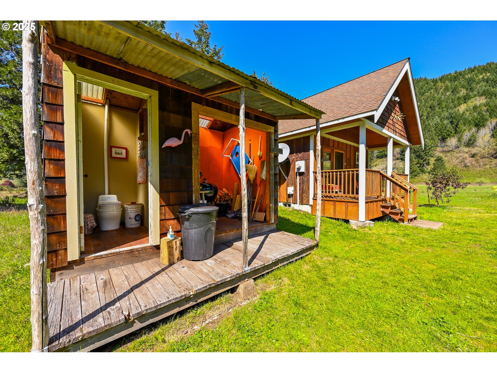 38305 Lower Brice Creek Road Dorena, OR 97434 - Photo 16 of 40 a view of a house with backyard and porch