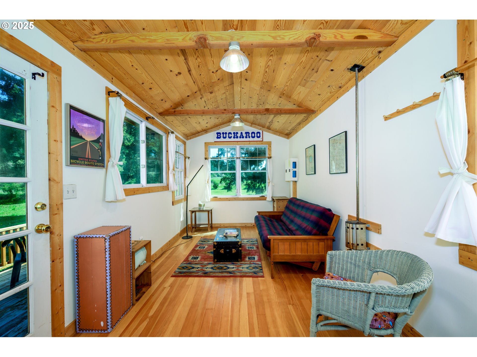 38305 Lower Brice Creek Road Dorena, OR 97434 - Photo 19 of 40 a living room with furniture and a large window