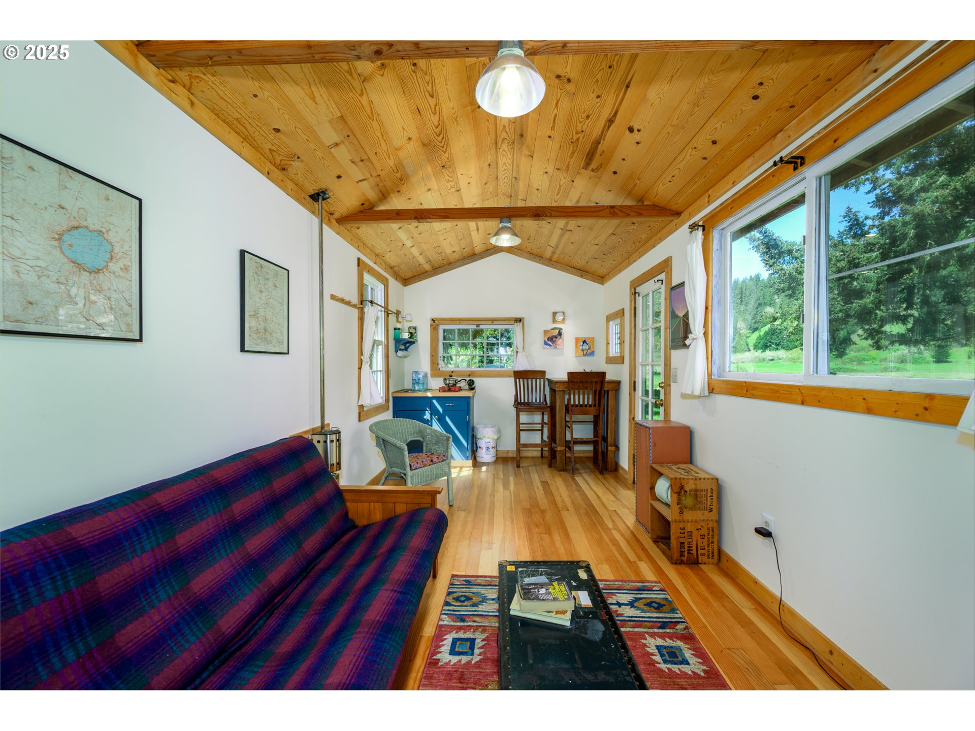 38305 Lower Brice Creek Road Dorena, OR 97434 - Photo 20 of 40 a living room with furniture dining table and a large window