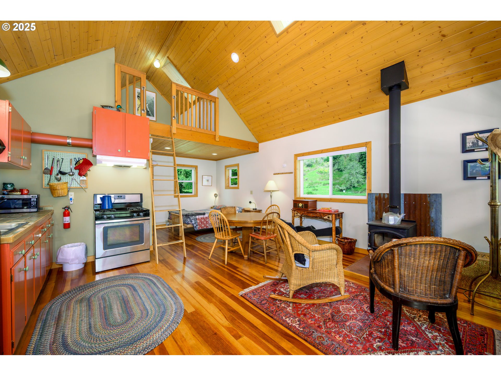 38305 Lower Brice Creek Road Dorena, OR 97434 - Photo 6 of 40 a living room with furniture a flat screen tv and a table