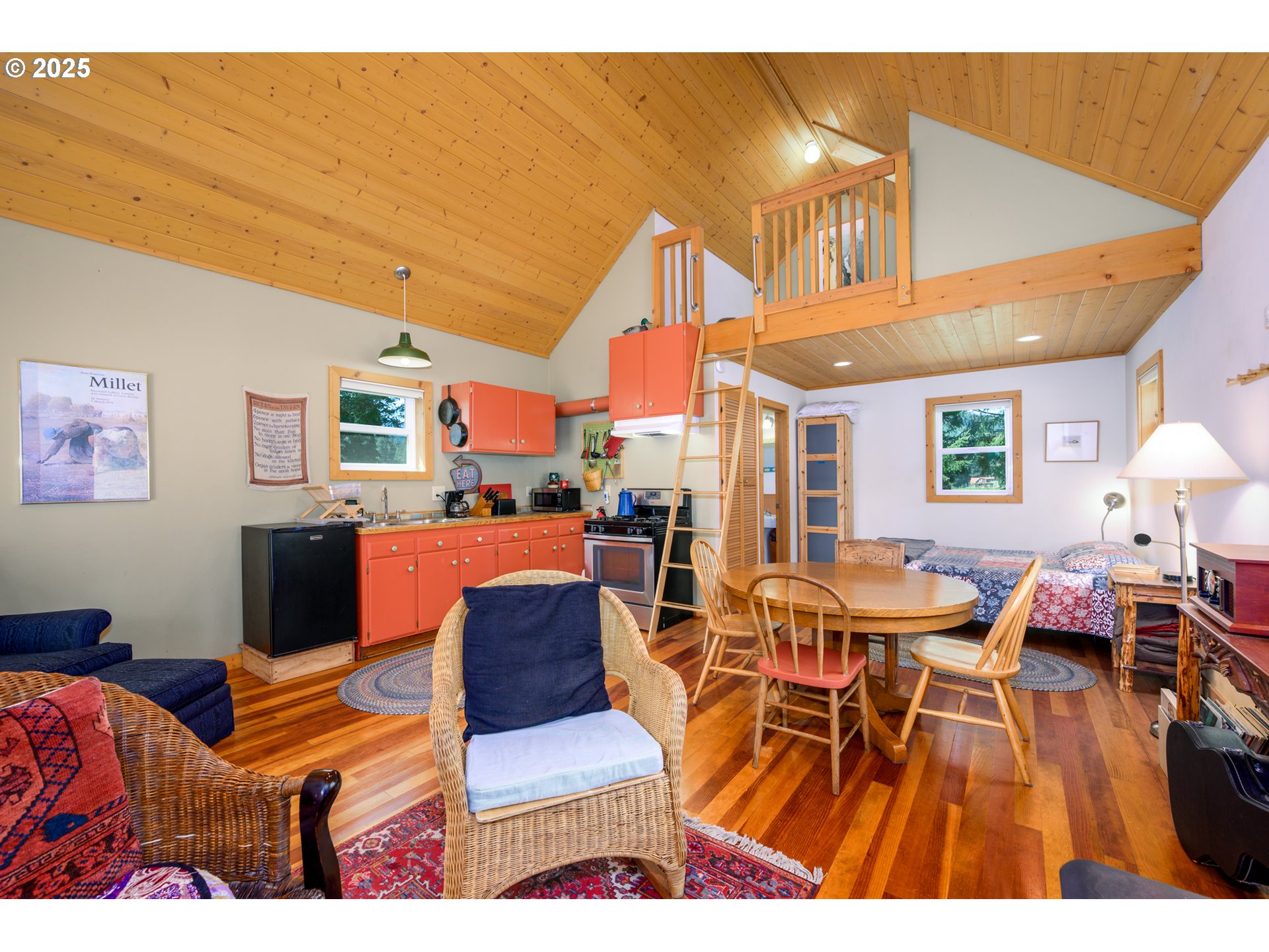 38305 Lower Brice Creek Road Dorena, OR 97434 - Photo 7 of 40 a living room with furniture a wooden floor and next to a window