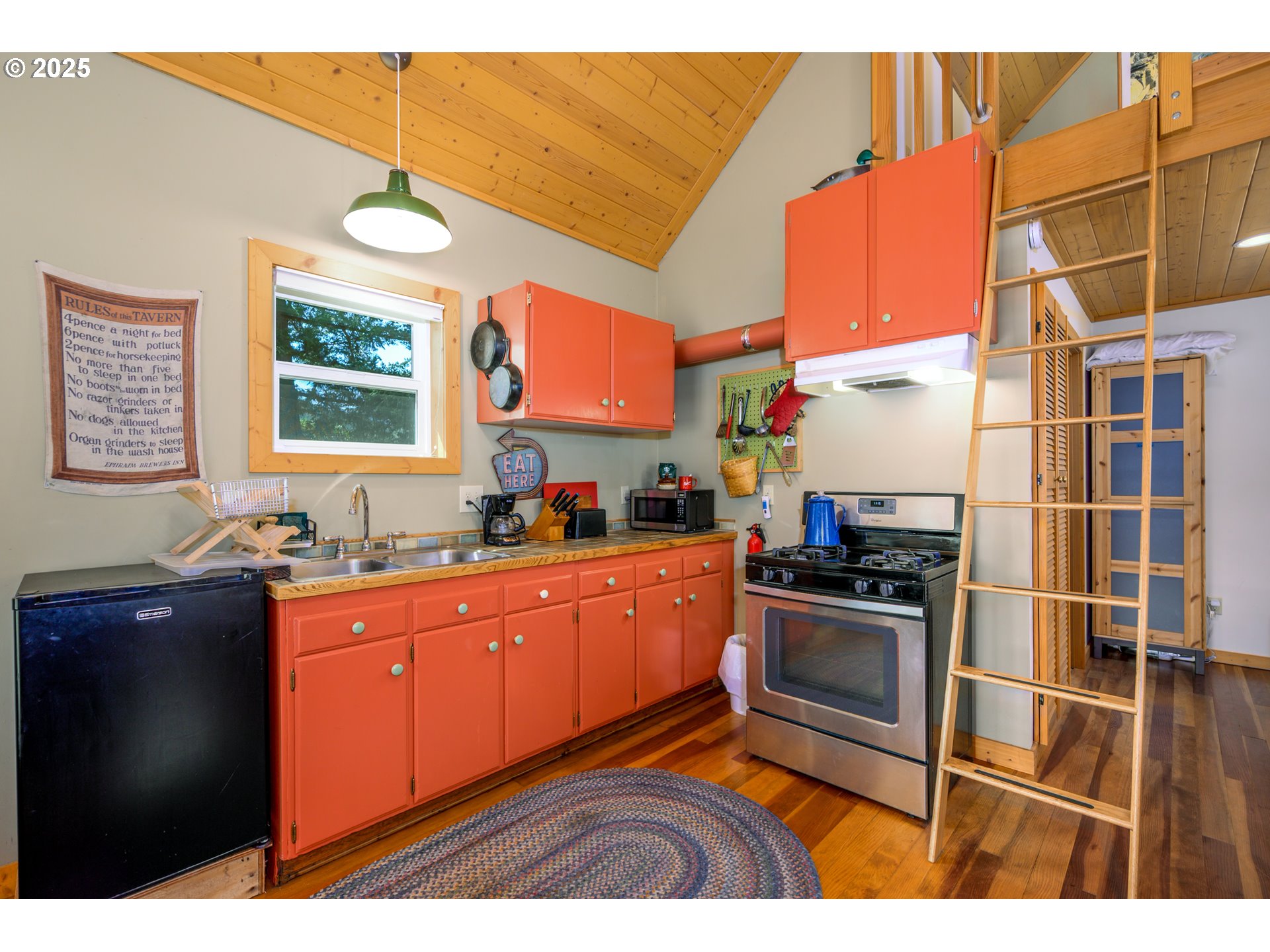 38305 Lower Brice Creek Road Dorena, OR 97434 - Photo 8 of 40 a kitchen with stainless steel appliances granite countertop a stove a sink and a microwave