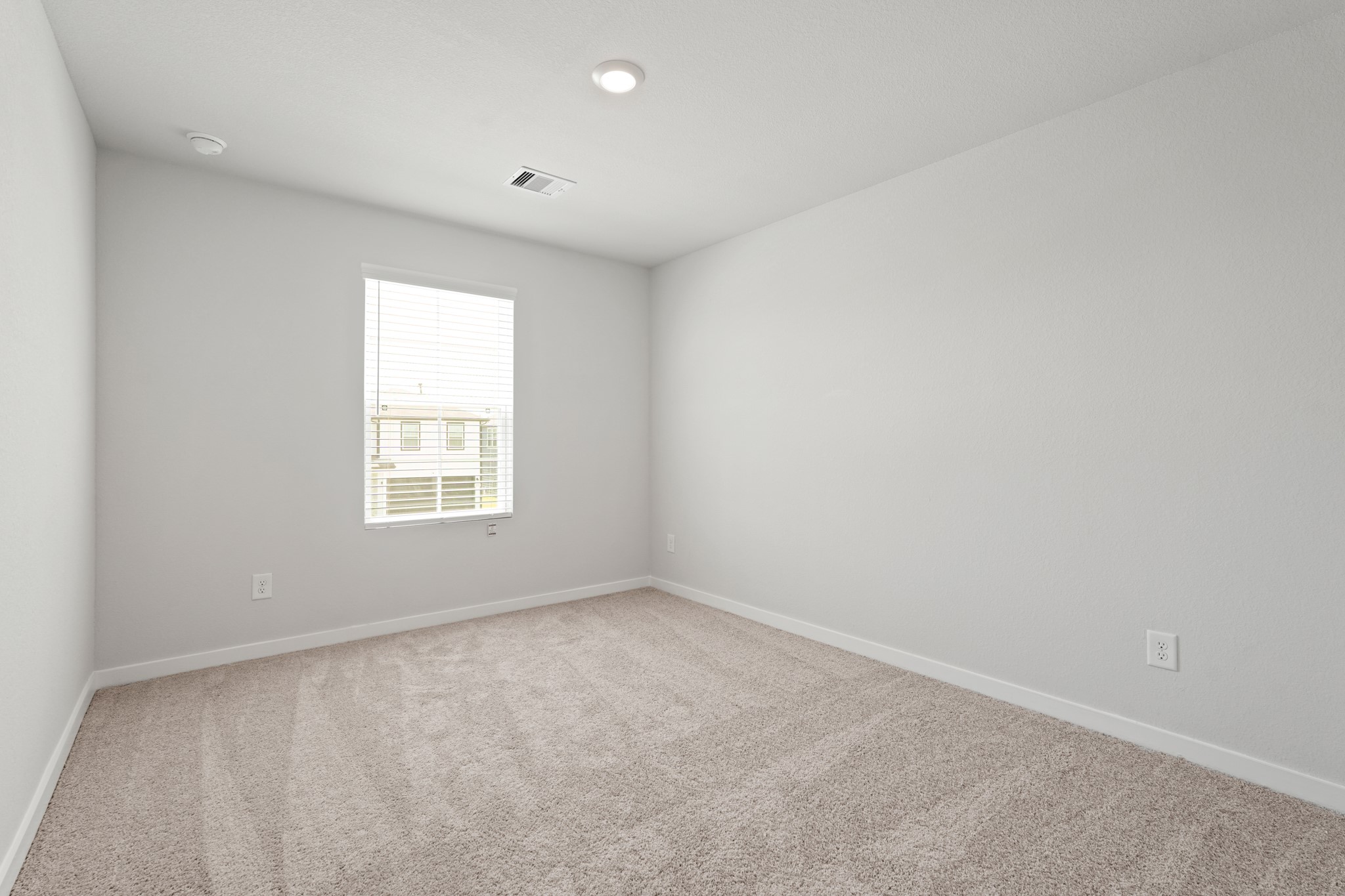 17219 King Eider Road Waller, TX 77484 - Photo 17 of 29 an empty room with a window