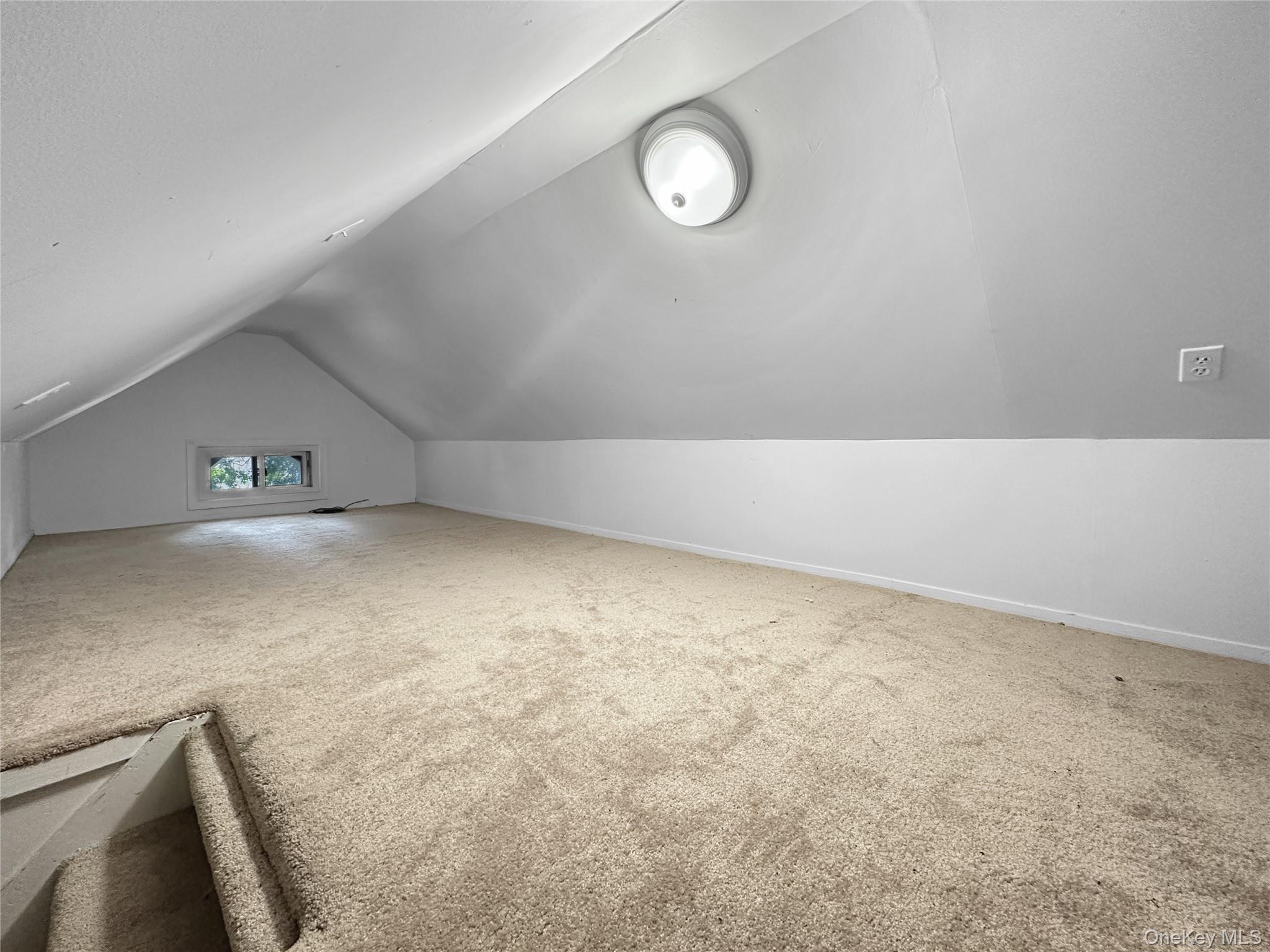 109-66 153rd Street Queens, NY 11433 - Photo 11 of 15 Bonus room with lofted ceiling and carpet floors
