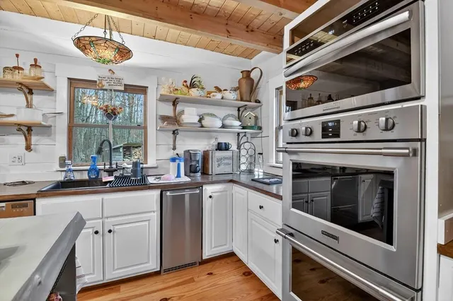 a view of a hall with wooden floor