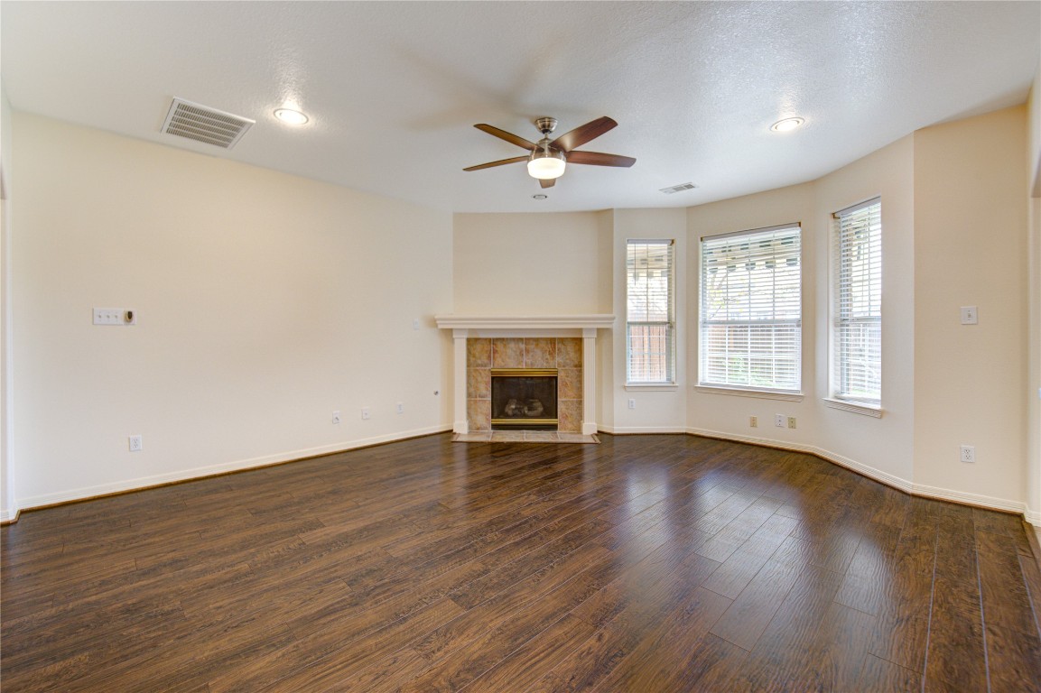 7611 South Linpar Court Houston, TX 77040 - Photo 12 of 49 a view of an empty room with wooden floor and a window