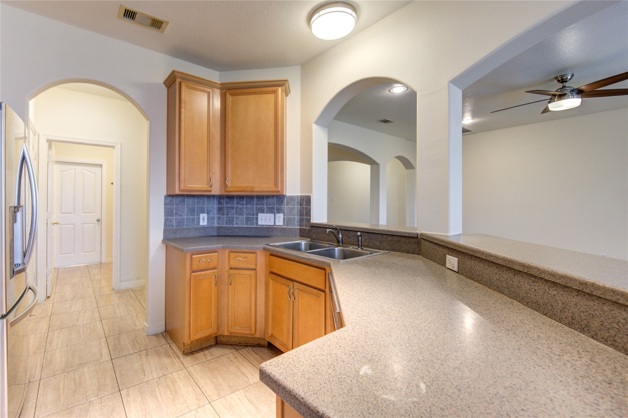 7611 South Linpar Court Houston, TX 77040 - Photo 17 of 48 a spacious bathroom with a granite countertop sink a mirror and a bathtub
