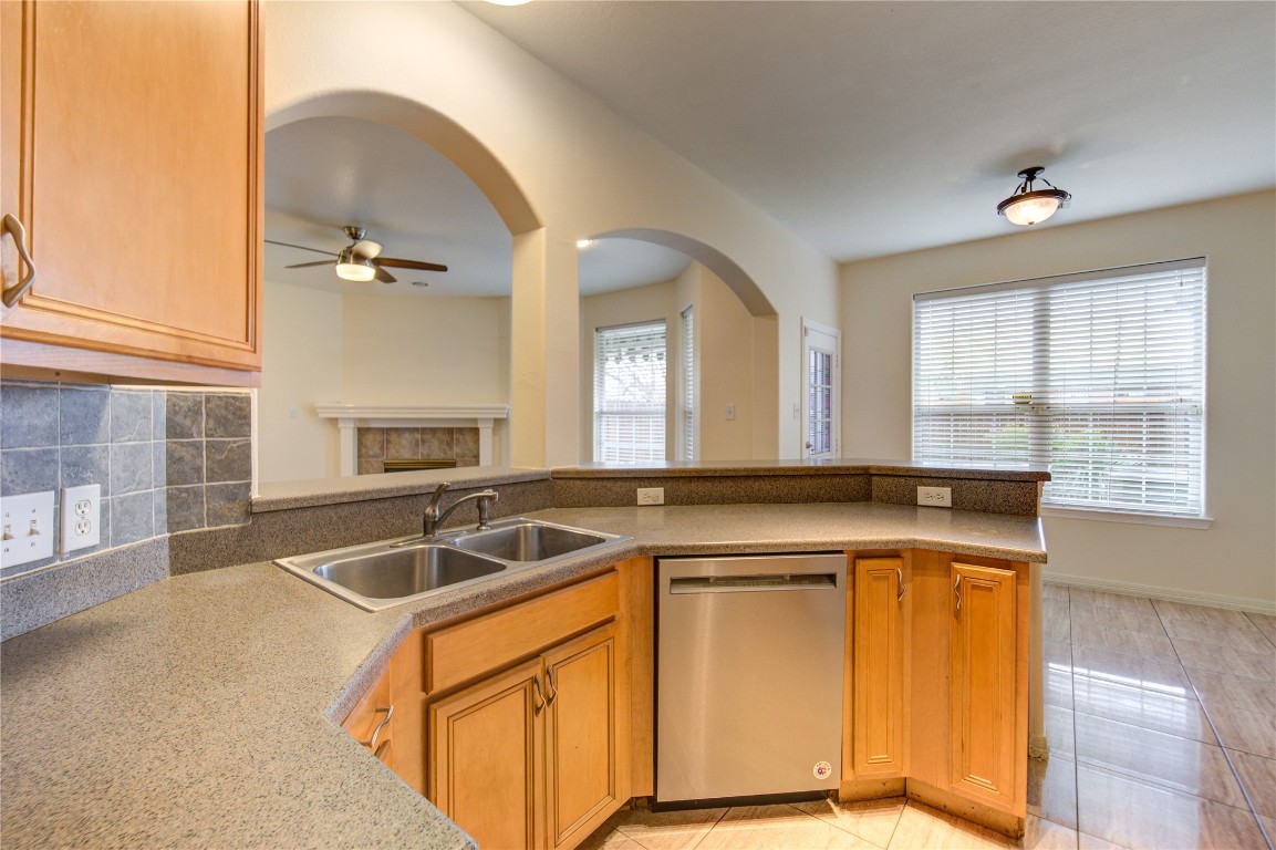 7611 South Linpar Court Houston, TX 77040 - Photo 19 of 49 a kitchen that has a sink and a stove