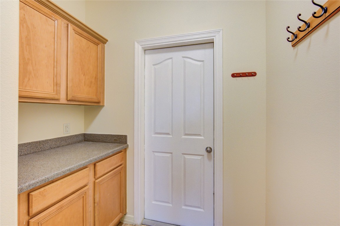 7611 South Linpar Court Houston, TX 77040 - Photo 20 of 49 a view of cabinets and wooden floor
