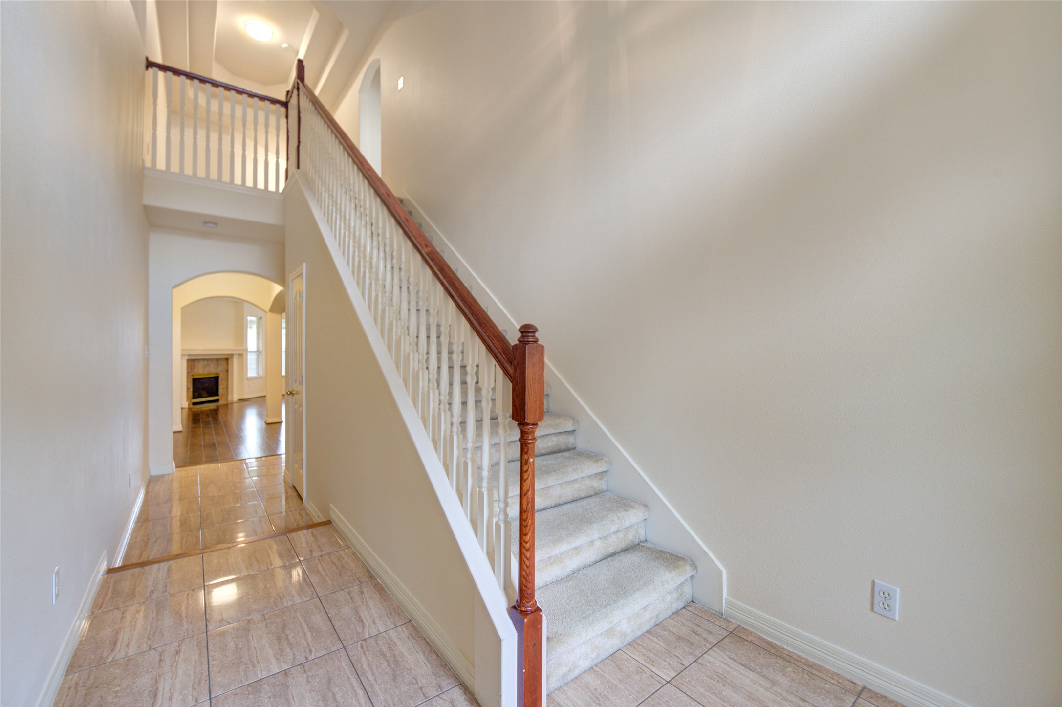 7611 South Linpar Court Houston, TX 77040 - Photo 24 of 48 a view of staircase with railing and a clock
