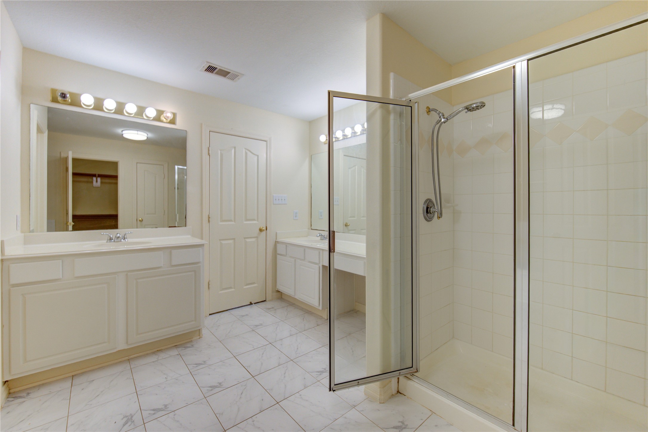 7611 South Linpar Court Houston, TX 77040 - Photo 35 of 48 a bathroom with a shower sink and mirror