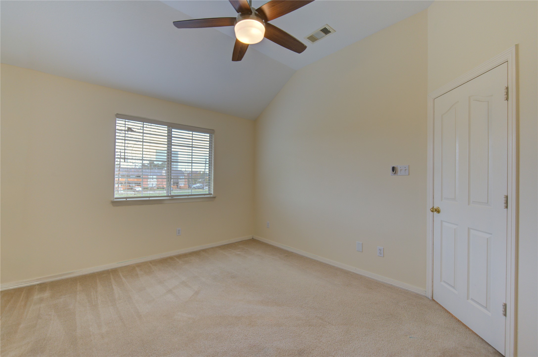 7611 South Linpar Court Houston, TX 77040 - Photo 38 of 48 an empty room with a window and a fan