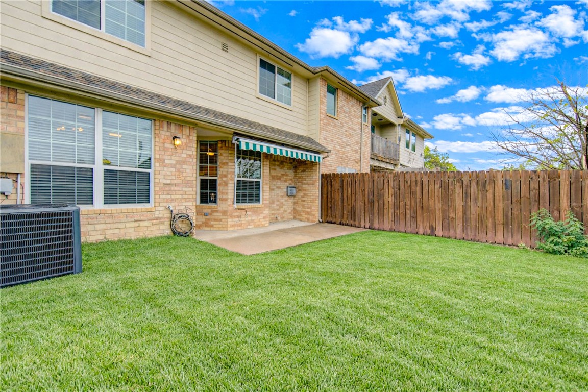 7611 South Linpar Court Houston, TX 77040 - Photo 47 of 49 a view of a house with backyard and wooden fence