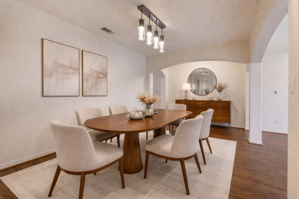 7611 South Linpar Court Houston, TX 77040 - Photo 7 of 49 a view of a dining room with furniture and wooden floor