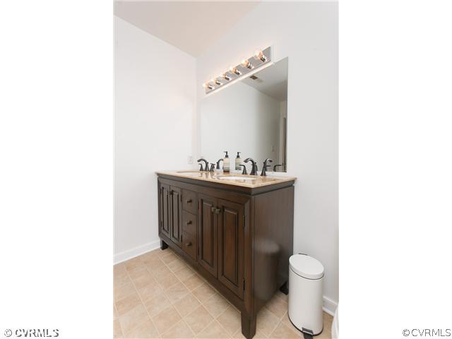 7317 Barkbridge Road Chesterfield, VA 23832 - Photo 16 of 24 a bathroom with a sink toilet and mirror