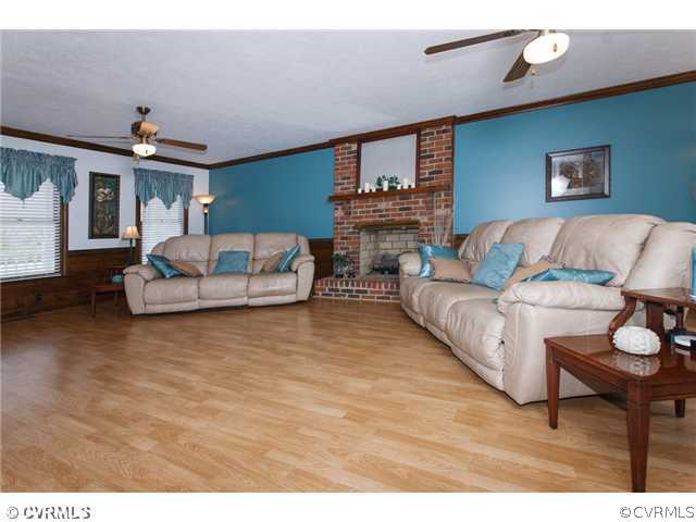 7317 Barkbridge Road Chesterfield, VA 23832 - Photo 5 of 24 a living room with furniture and a wooden floor