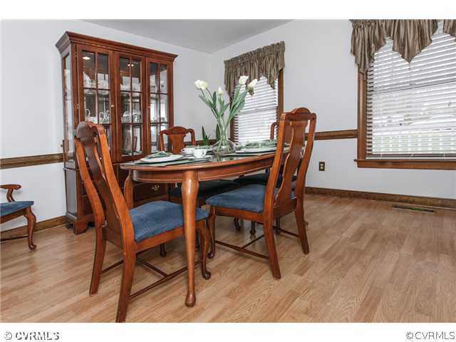 7317 Barkbridge Road Chesterfield, VA 23832 - Photo 7 of 24 a dining room with furniture and wooden floor