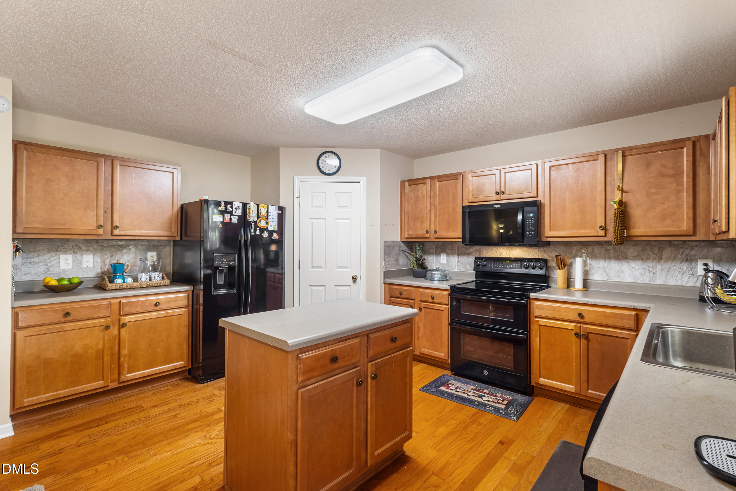 3748 Charleston Park Drive Raleigh, NC 27604 - Photo 12 of 34 a kitchen with stainless steel appliances granite countertop a refrigerator stove sink and microwave