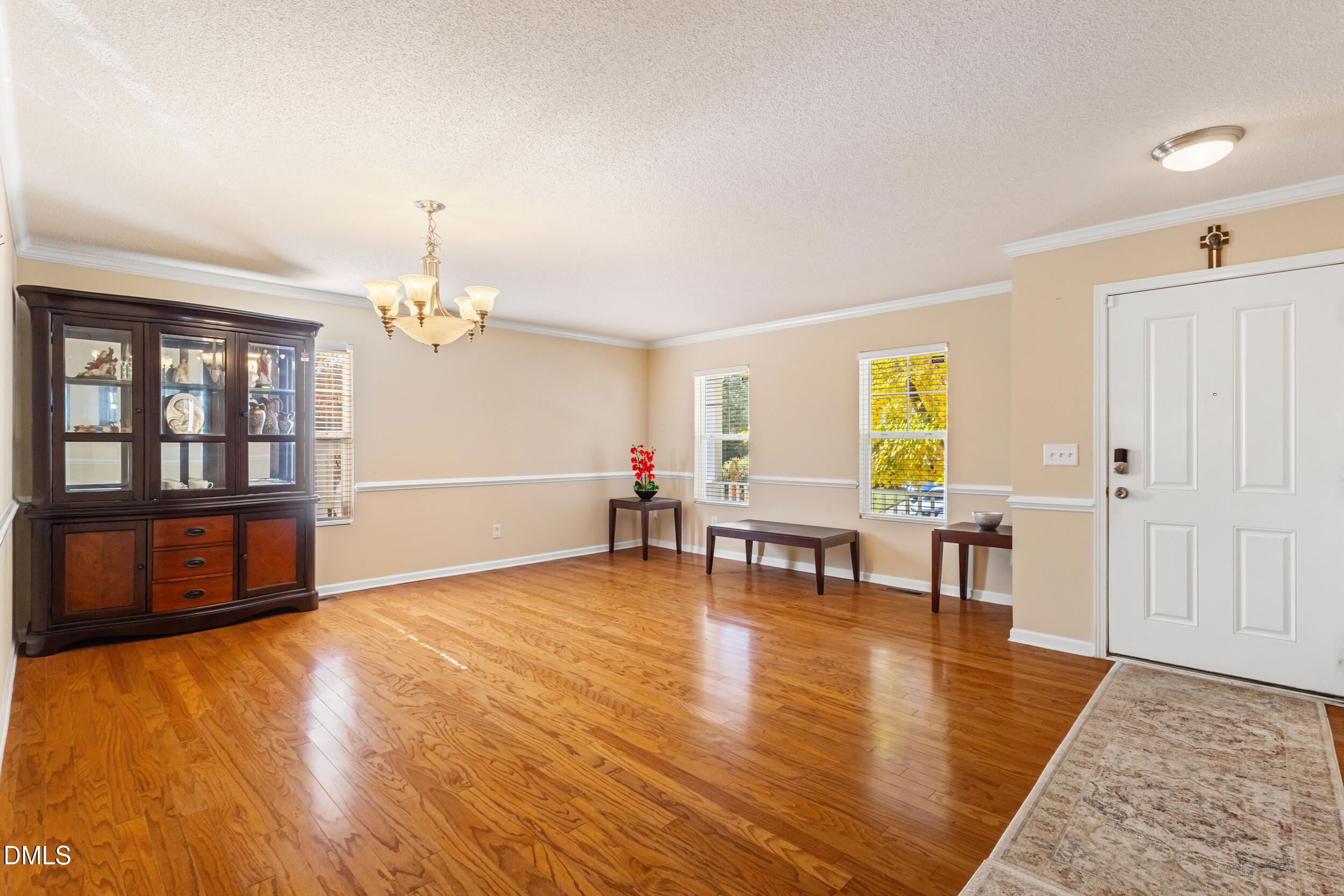 3748 Charleston Park Drive Raleigh, NC 27604 - Photo 15 of 34 a living room with furniture and a wooden floor