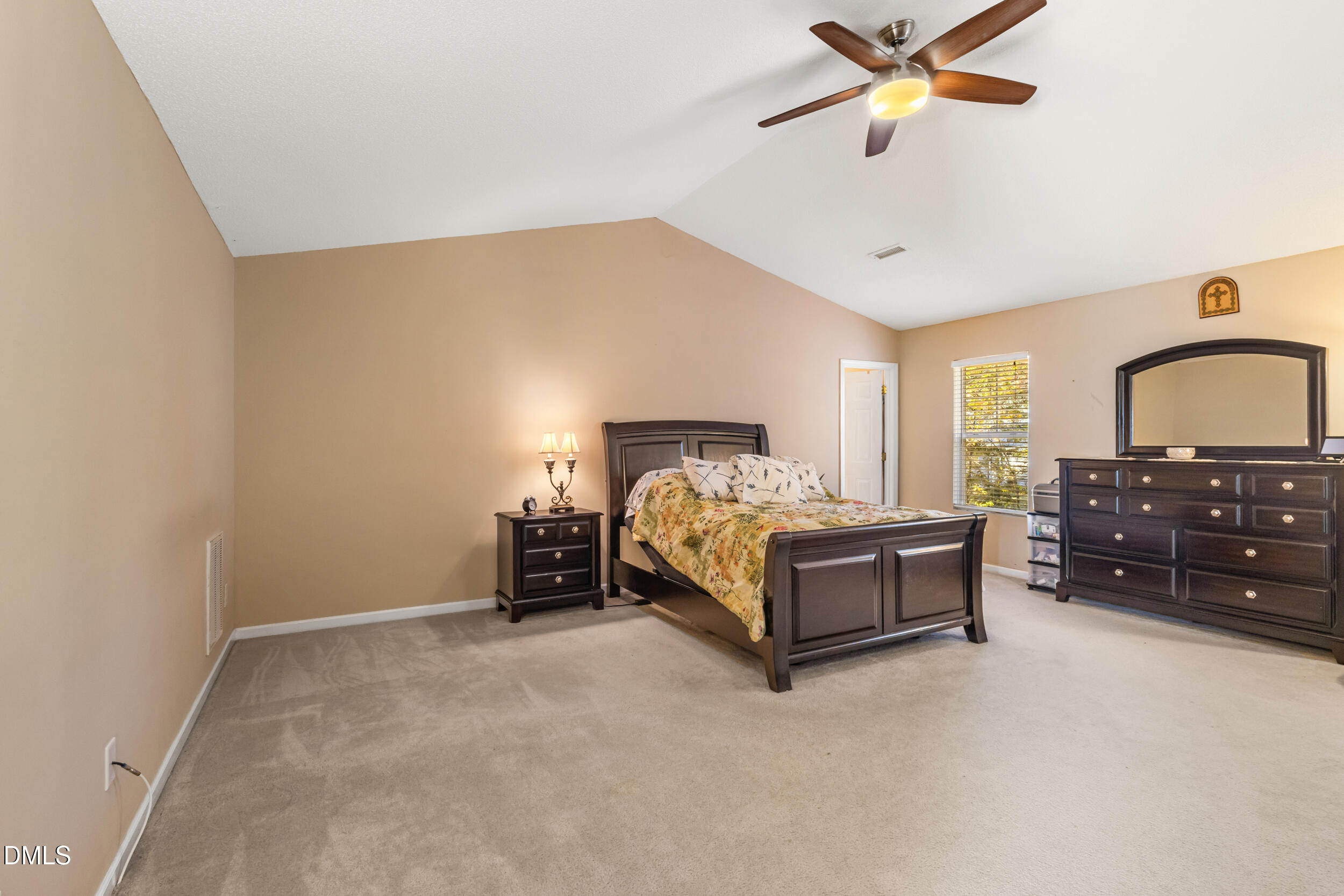3748 Charleston Park Drive Raleigh, NC 27604 - Photo 18 of 34 a spacious bedroom with a bed and window