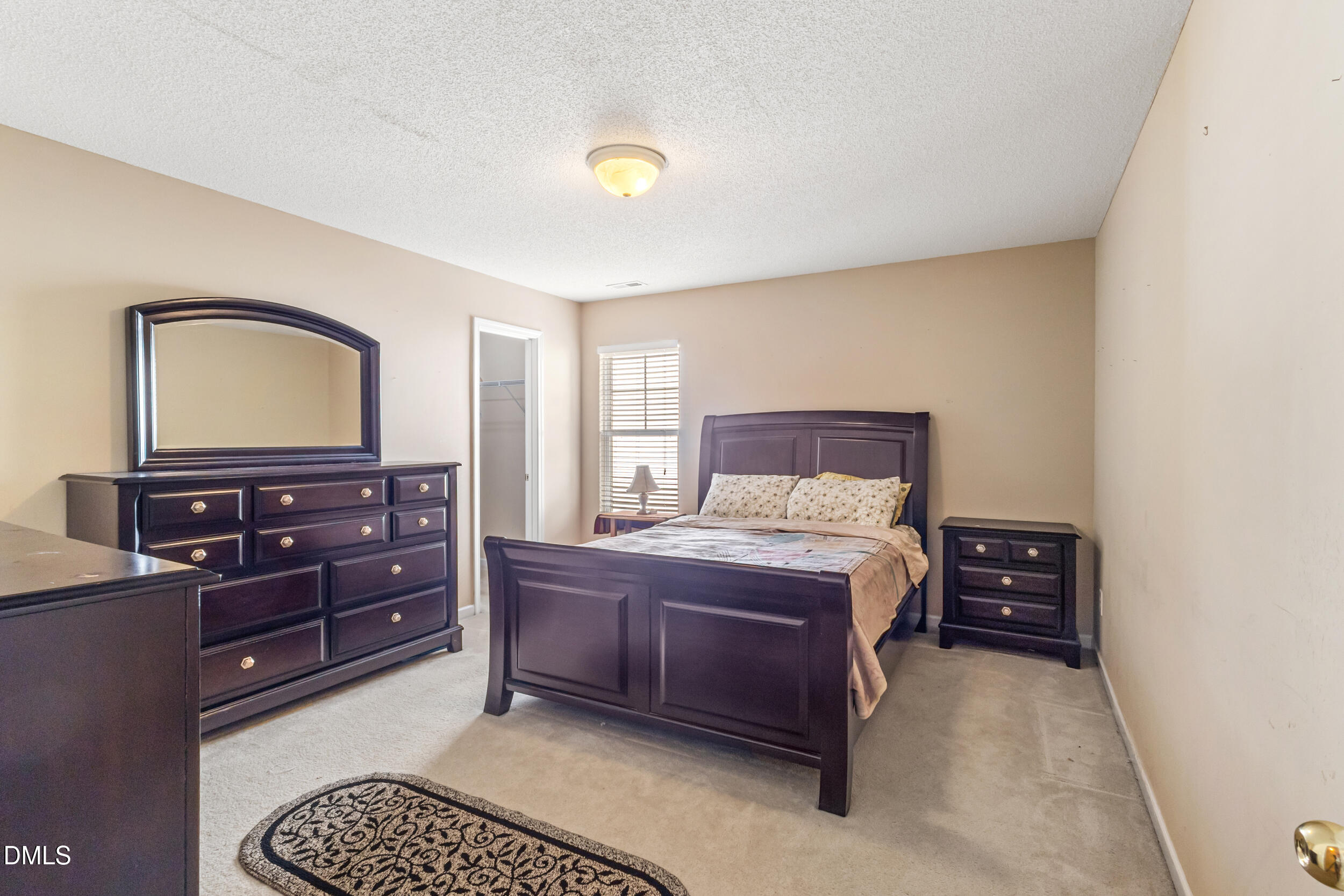 3748 Charleston Park Drive Raleigh, NC 27604 - Photo 23 of 34 a bedroom with a bed and a dresser