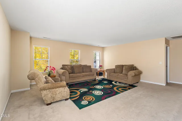 a living room with furniture and a couch