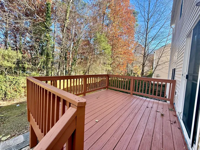 a view of deck with wooden floor and fence