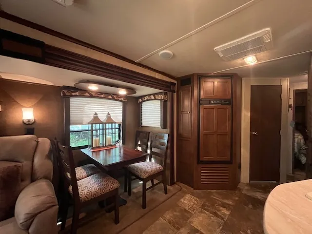 a large room with lots of furniture and a large window