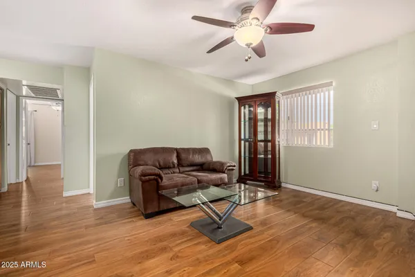 a living room with furniture and a window
