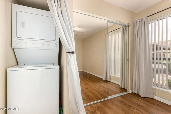 a view of a storage & utility room with a window