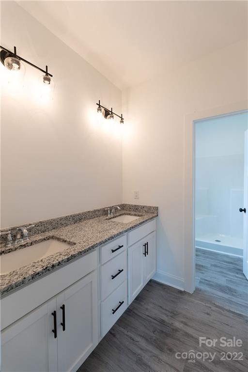 2231 State Rd S-46-1474, Unit 17 Clover, SC 29710 - Photo 11 of 20 a view of a kitchen with marble countertop cabinets and wooden floor