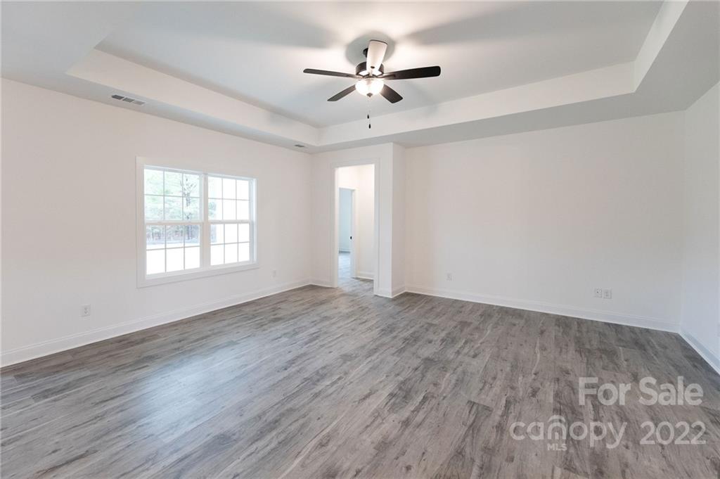 2231 State Rd S-46-1474, Unit 17 Clover, SC 29710 - Photo 14 of 20 wooden floor in an empty room with a window