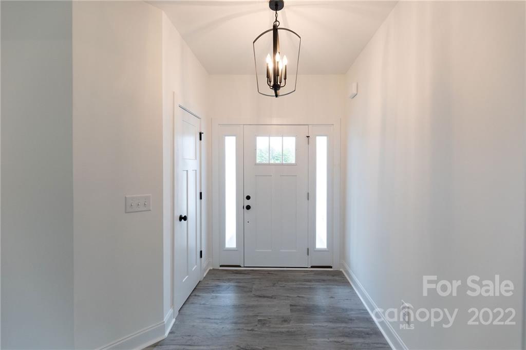 2231 State Rd S-46-1474, Unit 17 Clover, SC 29710 - Photo 8 of 20 a view of a hallway with wooden floor and closet