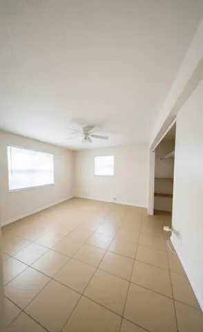 a view of an empty room and a window