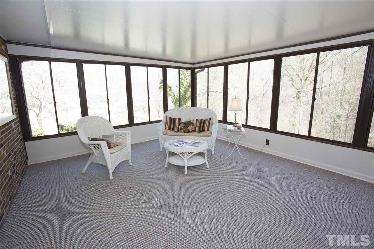 11100 Creedmoor Road Raleigh, NC 27614 - Photo 12 of 25 a living room with furniture and a large window