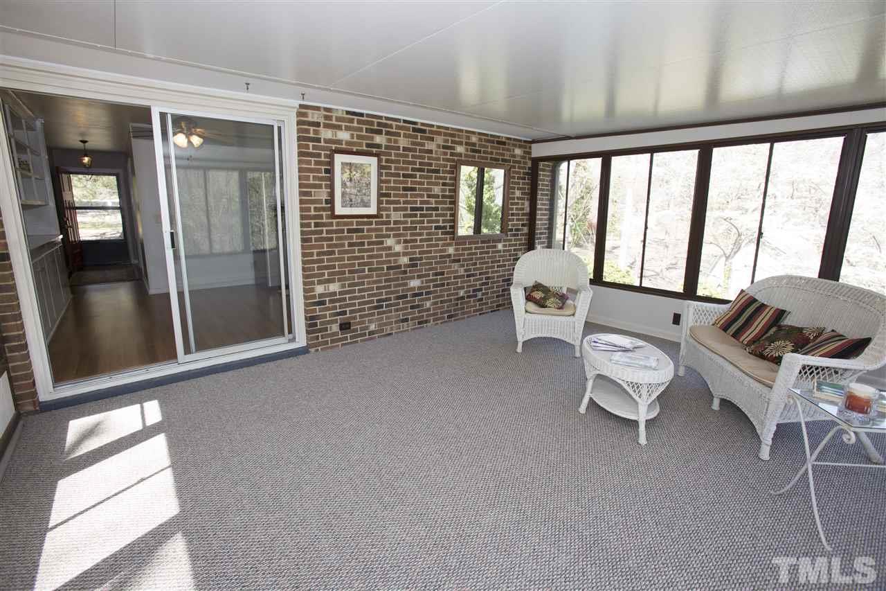 11100 Creedmoor Road Raleigh, NC 27614 - Photo 13 of 25 a living room with furniture and large windows