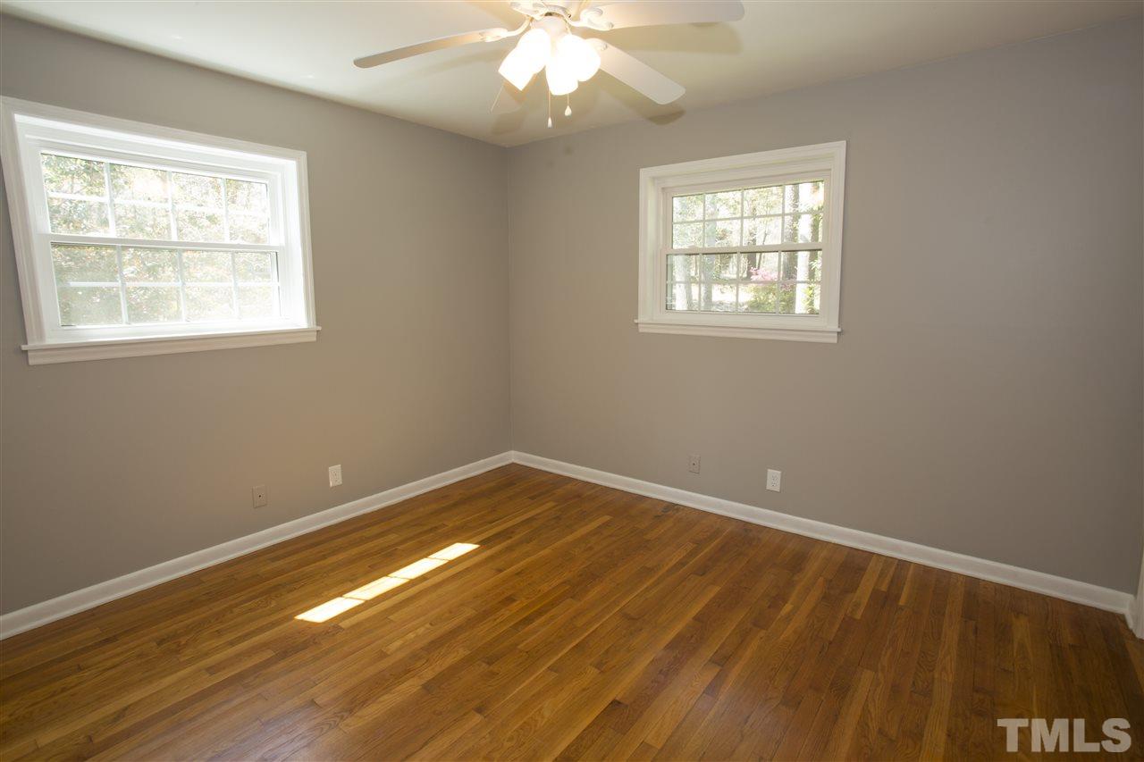 11100 Creedmoor Road Raleigh, NC 27614 - Photo 15 of 25 a view of an empty room with wooden floor and a window