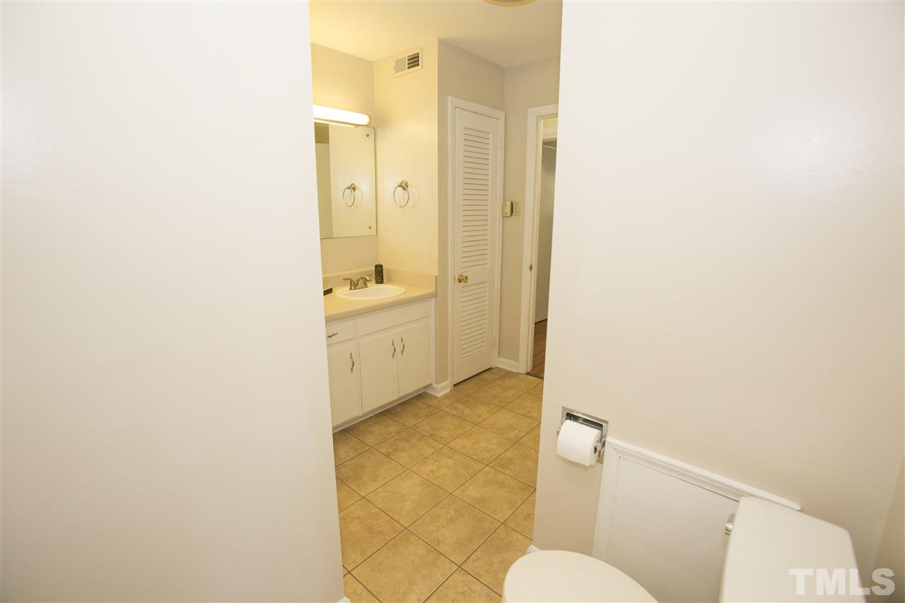 11100 Creedmoor Road Raleigh, NC 27614 - Photo 17 of 25 a bathroom with a granite countertop sink mirror vanity and toilet