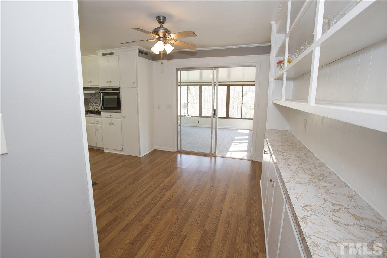 11100 Creedmoor Road Raleigh, NC 27614 - Photo 9 of 25 wooden floor in an empty room with a window