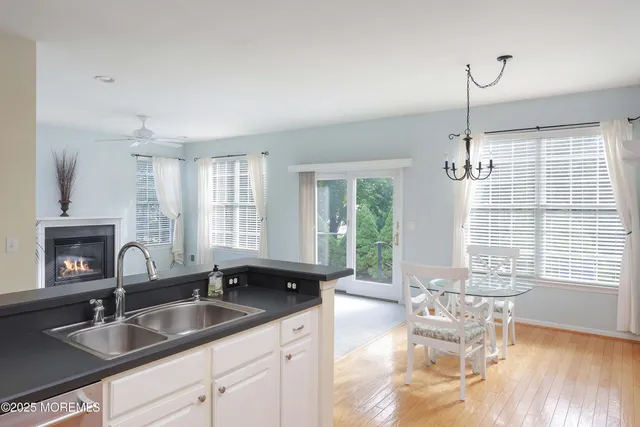 a kitchen with a sink and a large window
