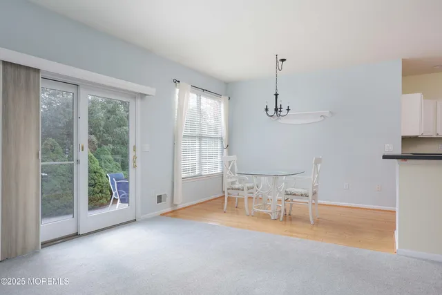 an empty room with windows and outdoor view