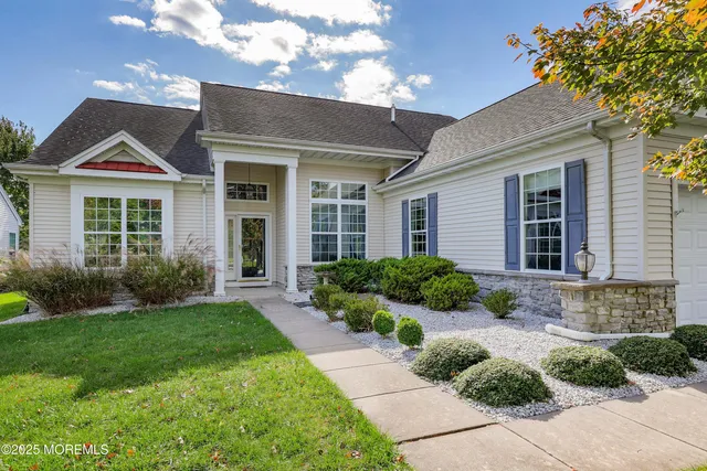 a living room with furniture fireplace and window