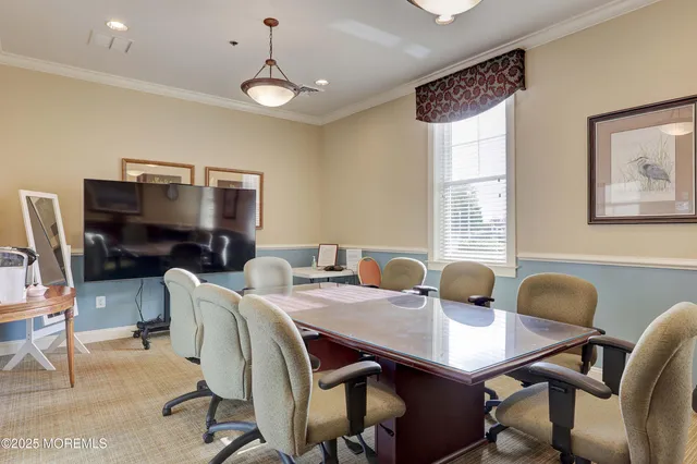 a very nice looking dining room with furniture window and outside view