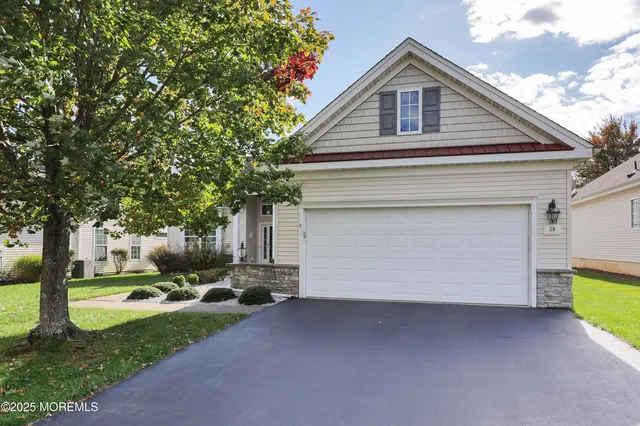 a front view of house with yard and green space