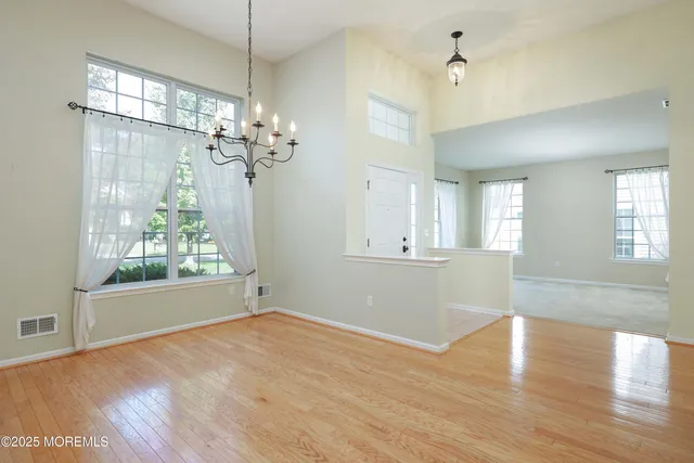 a view of livingroom with window and wooden floor