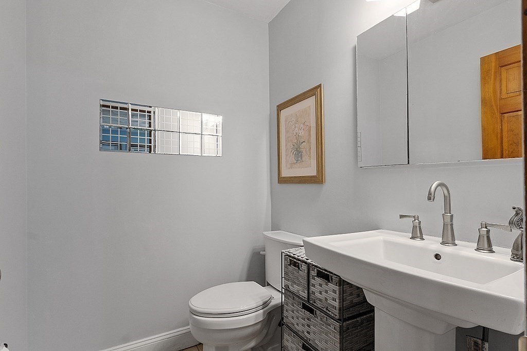 102 B Lunenburg Road Townsend, MA 01474 - Photo 13 of 41 a bathroom with a sink a toilet and mirror