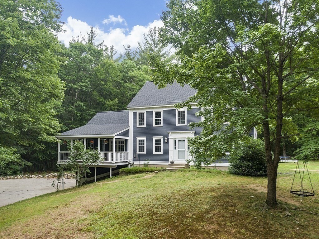 102 B Lunenburg Road Townsend, MA 01474 - Photo 30 of 41 a aerial view of a house with swimming pool next to a big yard