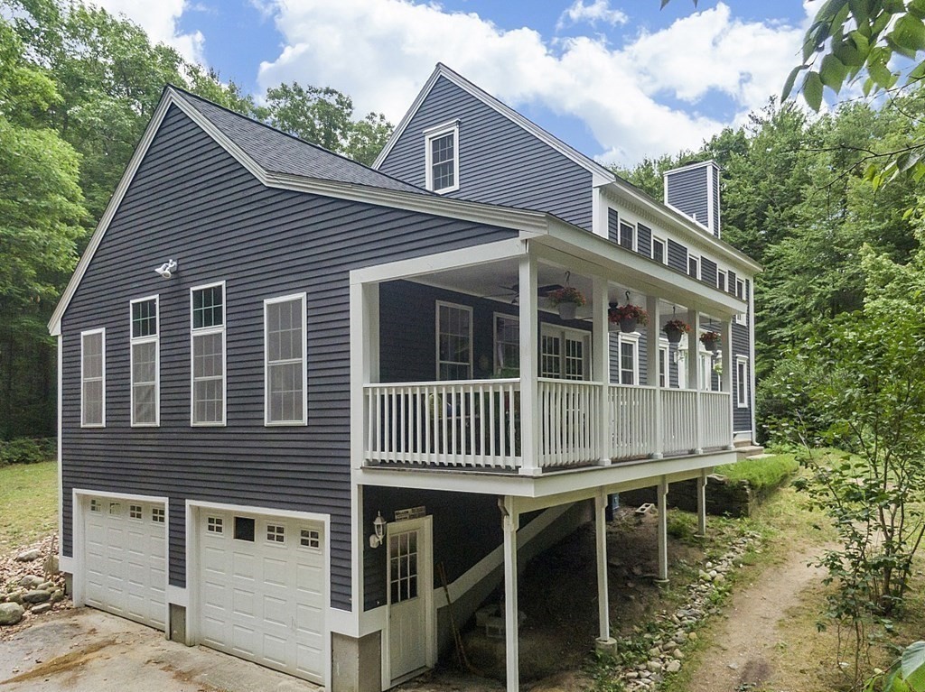 102 B Lunenburg Road Townsend, MA 01474 - Photo 4 of 41 a front view of a house with balcony